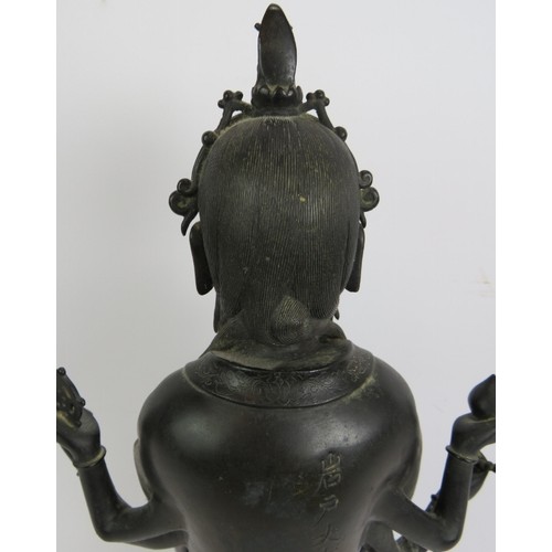 3 - An antique Chinese bronze figure of a Deity, probably the Buddhist Goddess Marici, with Chinese scri... 