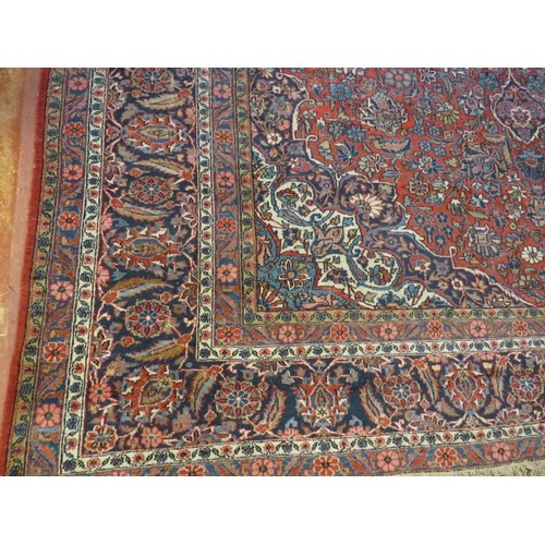 930 - A large good quality antique/vintage Persian Keshan carpet, decorated with central medallion and sty... 