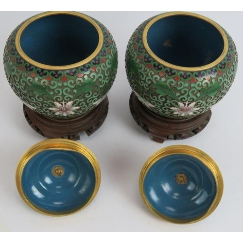 100 - A pair of high quality Chinese cloisonné enamel covered jars on stands of raised wire floral and fol... 