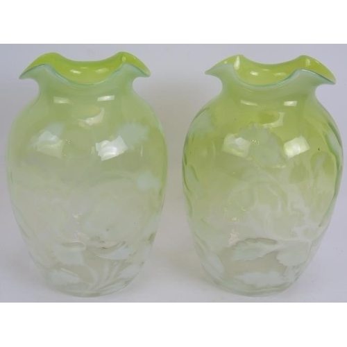 106 - A pair of antique graduated green Vaseline glass vases with foliate design. Ground pontils to bases,... 