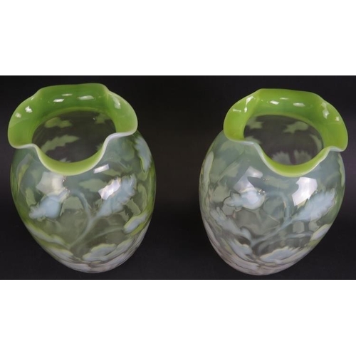 106 - A pair of antique graduated green Vaseline glass vases with foliate design. Ground pontils to bases,... 