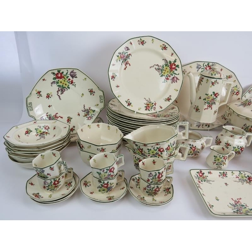 116 - A large Royal Doulton dinner service in 'Leeds Old Sprays' pattern including plates, coffee set, jug... 