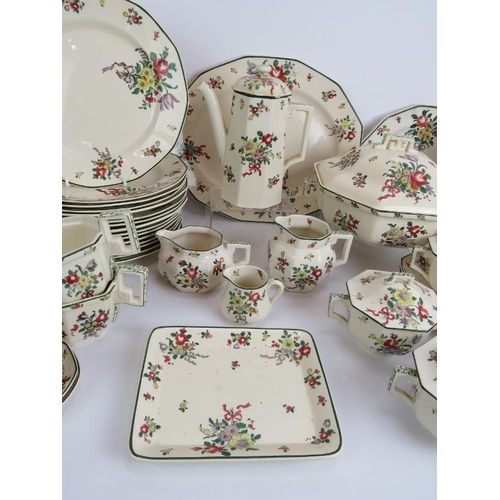 116 - A large Royal Doulton dinner service in 'Leeds Old Sprays' pattern including plates, coffee set, jug... 