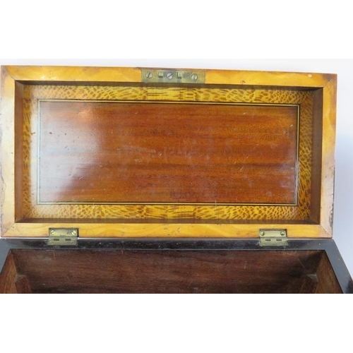 125 - A finely inlaid 19th century caddy box, a smaller sarcophagus shaped tea caddy and a light oak stati... 