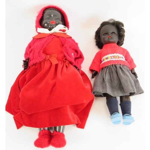 134 - A vintage 1950s pedigree black doll with red dress and bonnet and a 1970s 'Roddy' black plastic doll... 