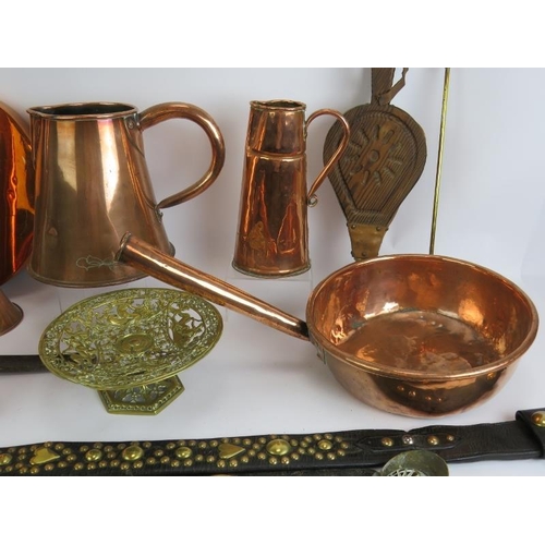 136 - A quantity of mainly antique copper and brassware including jugs, pans, post horn, bellows, horse ha... 