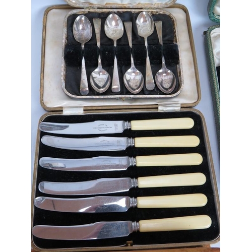 142 - A quantity of silver plated cutlery including a boxed grapefruit set, tea spoons and knives, a three... 