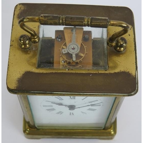 143 - A brass cased 8 day carriage clock with white enamel dial. Height 14cm.
Condition report: No key, ca... 