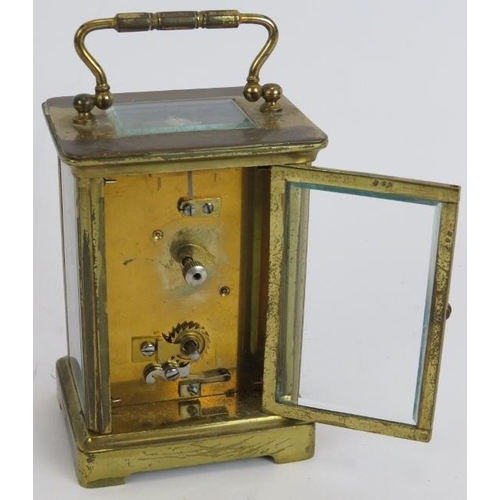 143 - A brass cased 8 day carriage clock with white enamel dial. Height 14cm.
Condition report: No key, ca... 