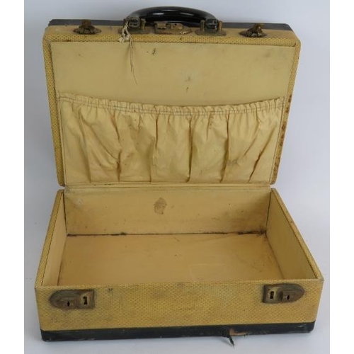 145 - A vintage 1930s two compartment travel vanity case with interior fittings and original steamer label... 