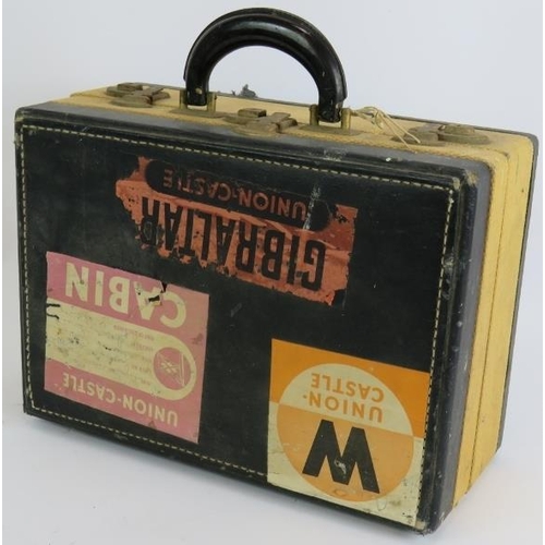 145 - A vintage 1930s two compartment travel vanity case with interior fittings and original steamer label... 