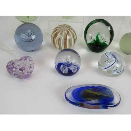 147 - A collection of 15 glass paperweights of various design including goldfish, bees, birds and shamrock... 