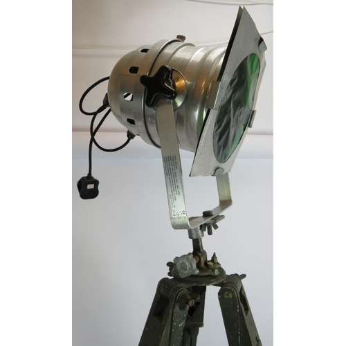 153 - An aluminium PAR 64S theatre light with green lens mounted on a vintage green wooden adjustable trip... 