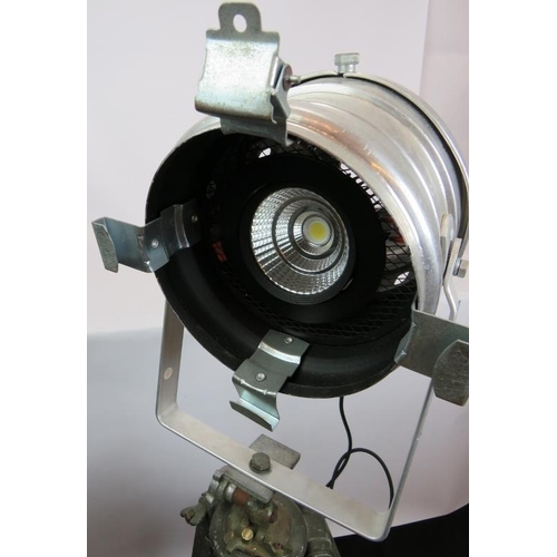 153 - An aluminium PAR 64S theatre light with green lens mounted on a vintage green wooden adjustable trip... 