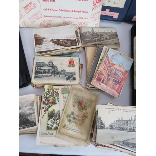 154 - A collection of mainly WWI era postcards and photos including military and European and British view... 