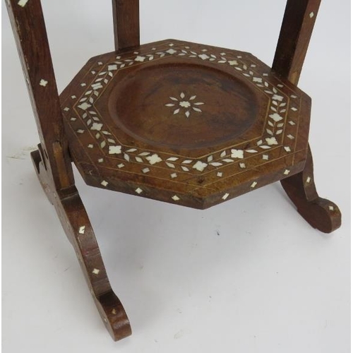 155 - A vintage Eastern folding cake stand with bone inlay to the frame and three octagonal trays. Overall... 