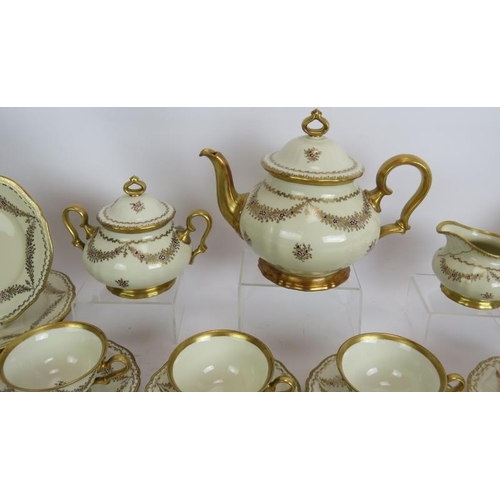 156 - A 21 piece Rosenthal Chippendale porcelain tea service hand decorated with gilt swags. Signed R Chio... 