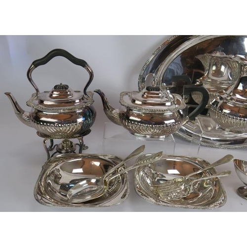 166 - An antique four piece silver plated tea/coffee set with ebony handles, an oval tray, two serving dis... 