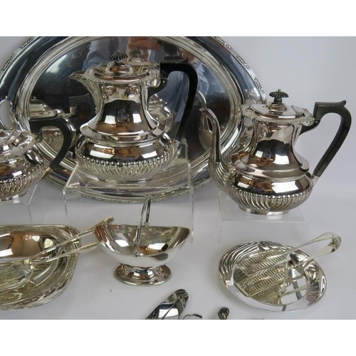 166 - An antique four piece silver plated tea/coffee set with ebony handles, an oval tray, two serving dis... 