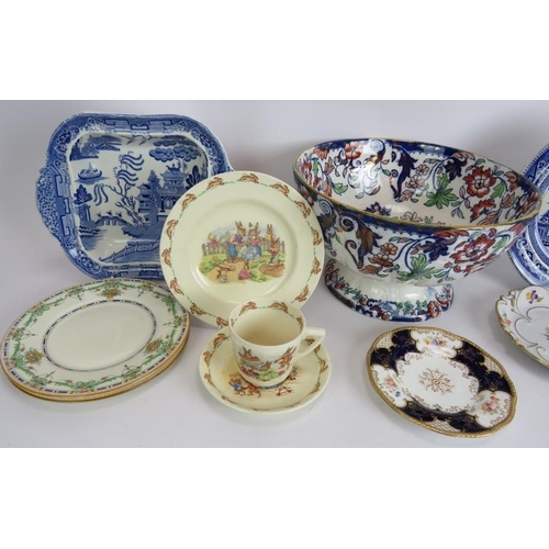 167 - A large footed ironstone bowl, two Willow pattern heated plates, a similar dish, a Royal Doulton Bun... 