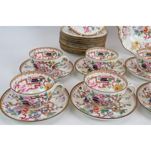 17 - A mid 19th century Minton porcelain part tea service in tree pattern. Consisting of 9 cups, 10 sauce... 