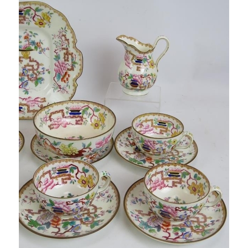 17 - A mid 19th century Minton porcelain part tea service in tree pattern. Consisting of 9 cups, 10 sauce... 