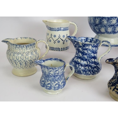 177 - Ten mainly 19th century blue and white Spongeware pottery jugs, tallest 24cm. (10).
Condition report... 