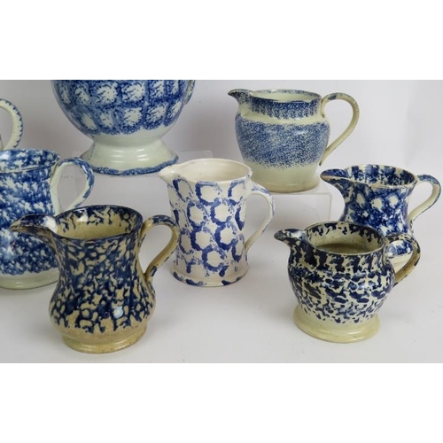 177 - Ten mainly 19th century blue and white Spongeware pottery jugs, tallest 24cm. (10).
Condition report... 