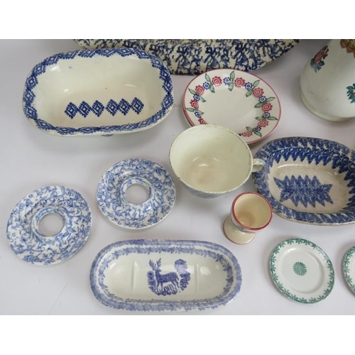 180 - A mixed lot of antique and later Spongeware pottery including two platters, dishes, jugs, egg cups e... 