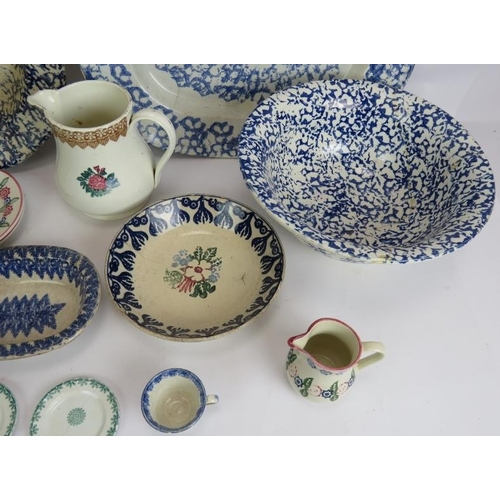 180 - A mixed lot of antique and later Spongeware pottery including two platters, dishes, jugs, egg cups e... 