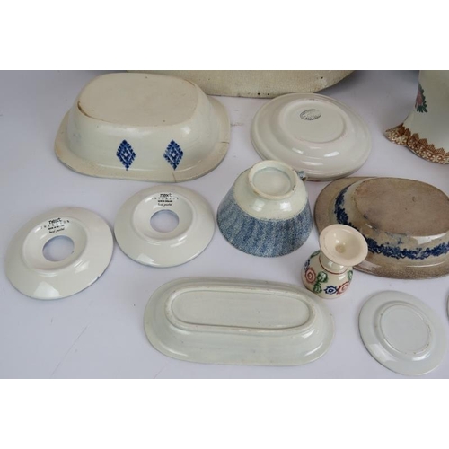 180 - A mixed lot of antique and later Spongeware pottery including two platters, dishes, jugs, egg cups e... 