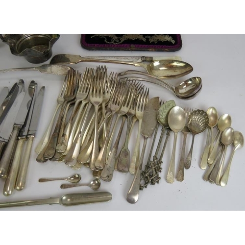 181 - A large quantity of silver plated cutlery, serving ware, decanter labels, cigarette case etc. (Qty).... 