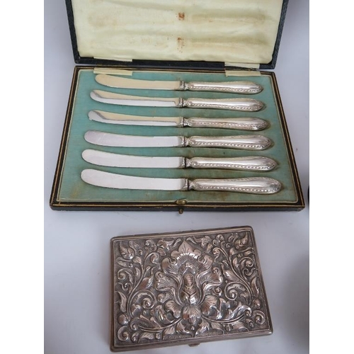 181 - A large quantity of silver plated cutlery, serving ware, decanter labels, cigarette case etc. (Qty).... 