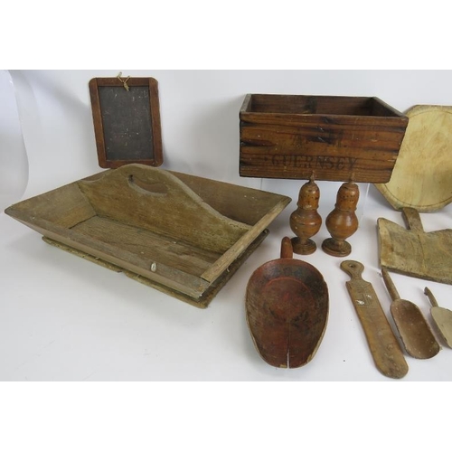 185 - A selection of treen Kitchenalia including a pine knife tray, chipping boards, turned shakers, a Gue... 