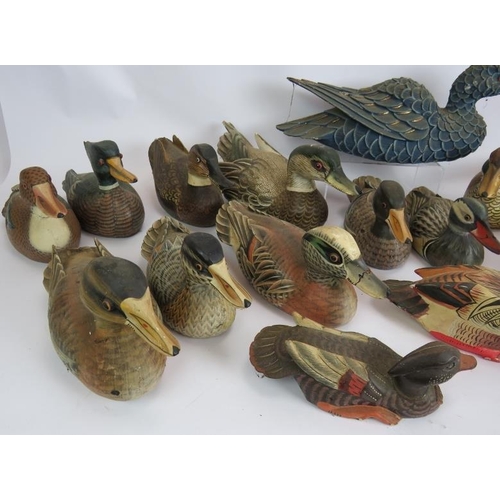 198 - Twenty hand painted carved wood decoy style ducks of varying size and colours. Largest 40cm long. (2... 