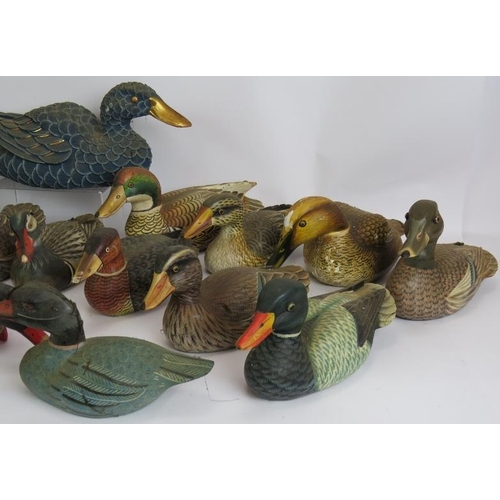 198 - Twenty hand painted carved wood decoy style ducks of varying size and colours. Largest 40cm long. (2... 