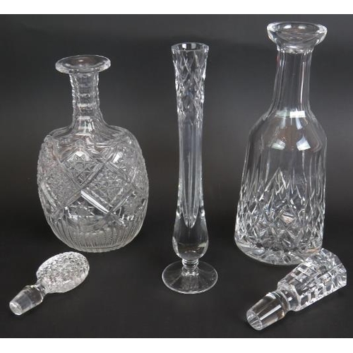 202 - A Waterford crystal decanter in Lismore pattern, an ovoid cut glass decanter with swag pattern and a... 