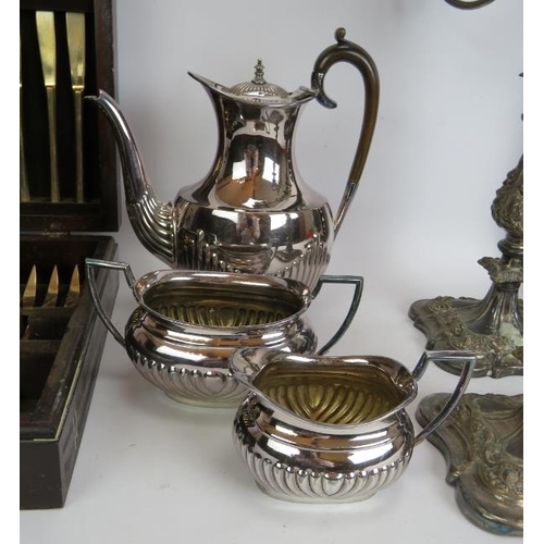 203 - A three piece silver plated coffee set, a boxed set of plated fish cutlery, a canteen of bronze cutl... 