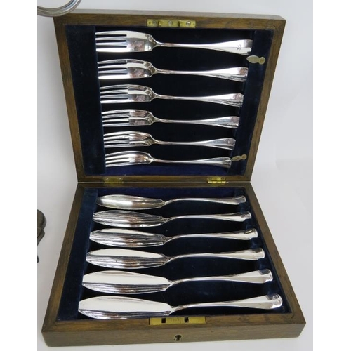 203 - A three piece silver plated coffee set, a boxed set of plated fish cutlery, a canteen of bronze cutl... 