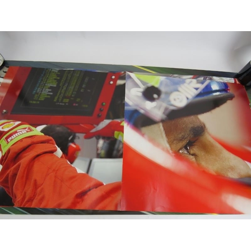 217 - A collection of mainly Formula 1 promotional posters and signed sheets including Kimi Raikkonen and ... 