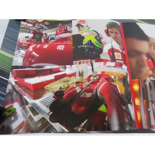 217 - A collection of mainly Formula 1 promotional posters and signed sheets including Kimi Raikkonen and ... 