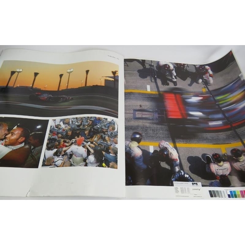 217 - A collection of mainly Formula 1 promotional posters and signed sheets including Kimi Raikkonen and ... 