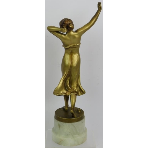 22 - An Art Deco gilded Spelter figure of a semi nude female dancer in the style of Lorenzl. Mounted on a... 