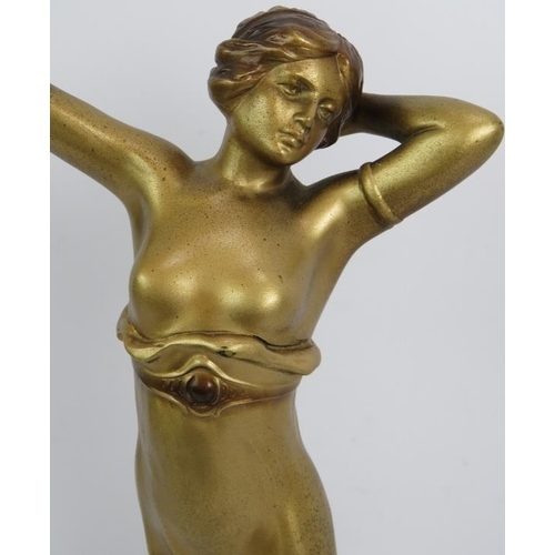 22 - An Art Deco gilded Spelter figure of a semi nude female dancer in the style of Lorenzl. Mounted on a... 