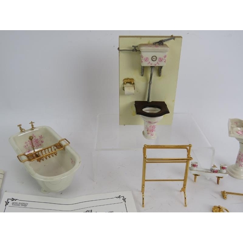 223 - A ceramic three piece doll's house bathroom suite including accessories by Ann Shepley Design.
Condi... 