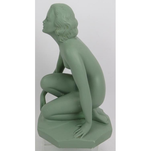 23 - An Art Deco plaster figure of a crouching nude with green painted finish. Incised mark 522 UB. Heigh... 