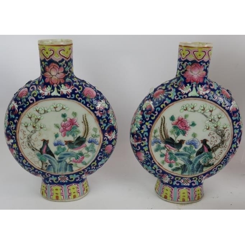 231 - A pair of hand decorated Japanese Imari vases, a pair of Chinese hand enamelled moon vases (restored... 