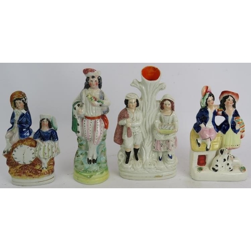 238 - Four 19th century Staffordshire pottery flat back figurines and a Coalport figurine of Paddington Be... 