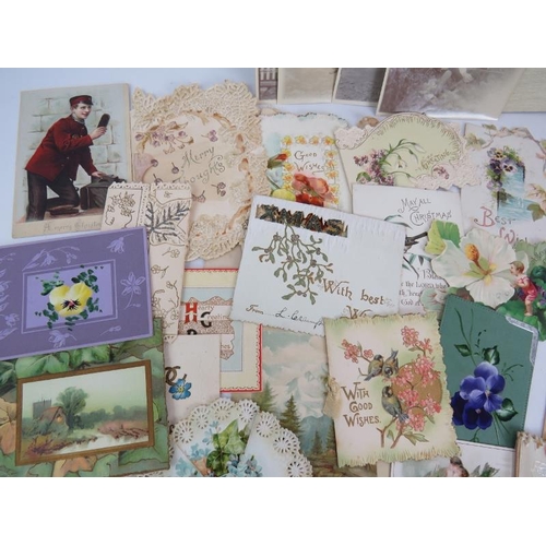 243 - A collection of early 20th century Christmas, greetings and memorial cards along with some local pos... 