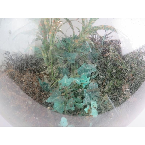 259 - A large green glass carboy planted as a terrarium with a mix of real and artificial plants. Height 5... 